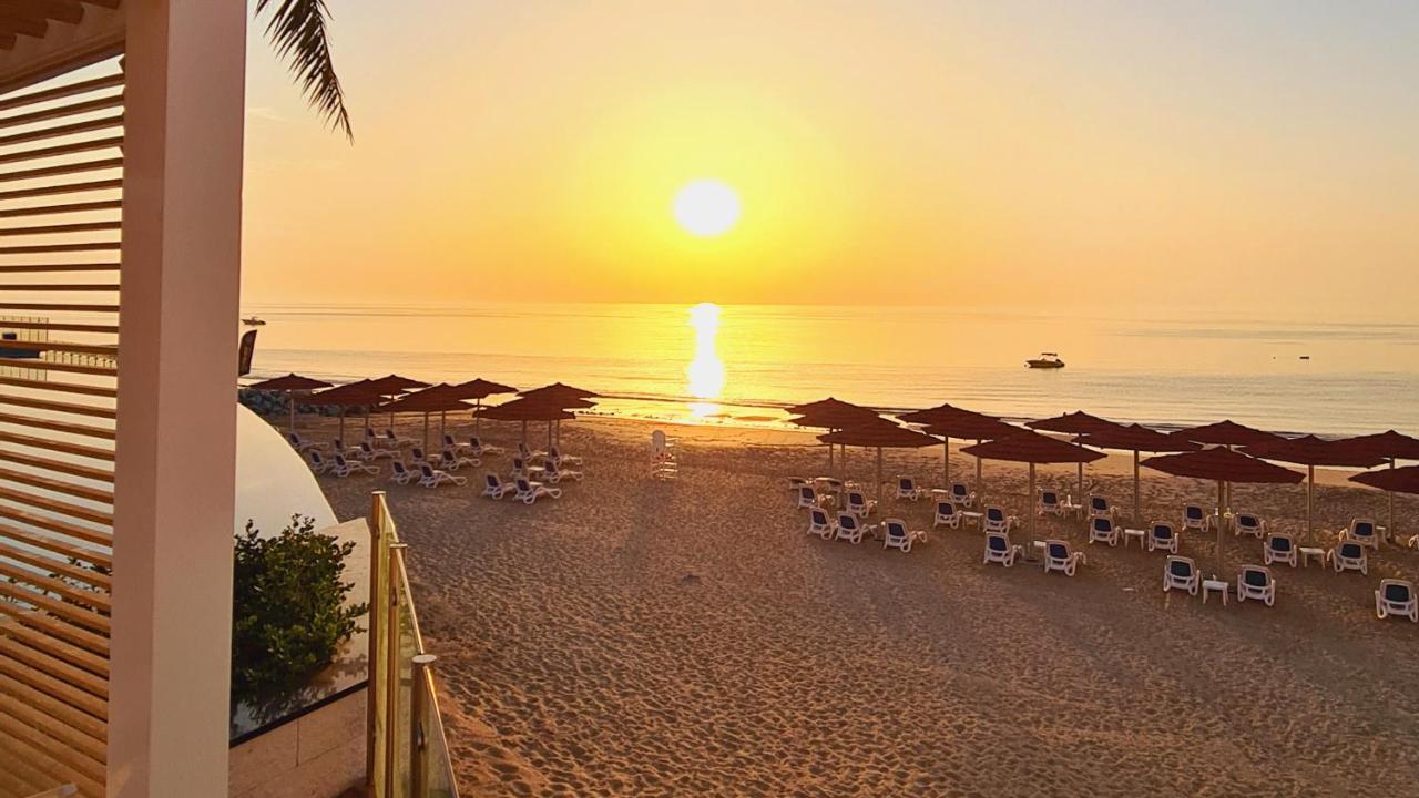 Royal M Al Aqah Beach Resort By Gewan 외부 사진 Sunset at the beach